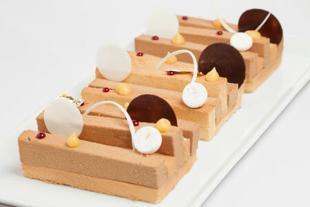 three cake on white dishの写真素材