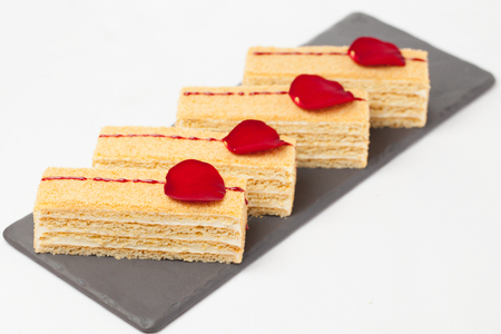 cakes on black dish & white backgroundの写真素材