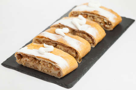 cakes on black dish & white backgroundの写真素材