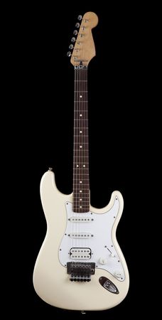 White electric guitar isolated against black backgroundの写真素材