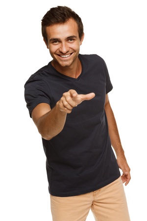 Young expressive male pointing at you, over white backgroundの写真素材