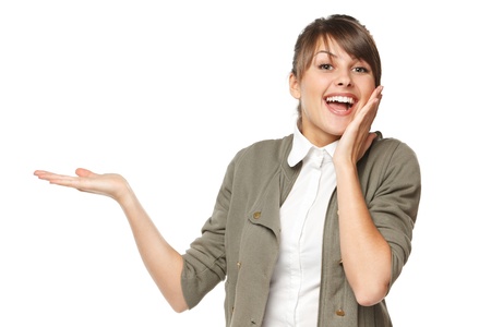 Surprised woman showing open hand palm with copy space for product or text, isolated on white backgroundの写真素材