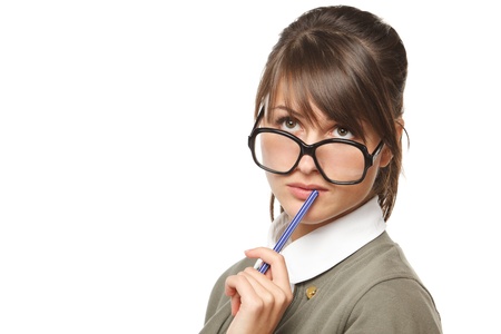 Close-up portrait of young pensive female wearing old fashioned eyeglasses looking up, isolated on white backgroundの写真素材