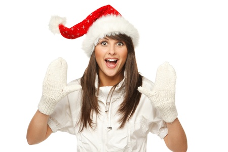 Enthusiastic girl in Santa hat shouting Xmas news, isolated on white bachgloundの写真素材