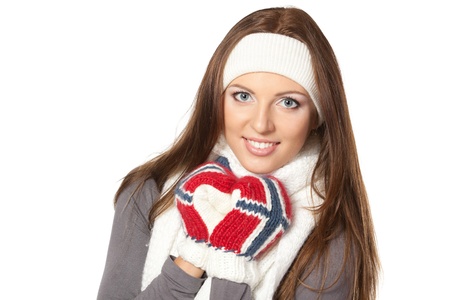 Closeup of a girl in warm clothing, over white backgroundの写真素材