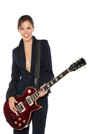 Young female in suit playing electric guitar isolated on white backgroundの写真素材