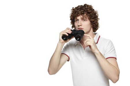 Portrait of a young male looking for new opportunities, over white baclgroundの写真素材