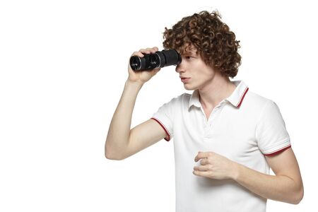 Portrait of a young male looking for new opportunities, over white backgroundの写真素材