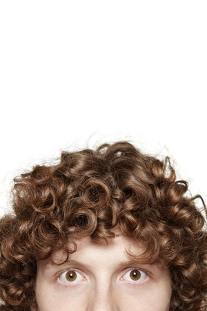 Cropped image of a young male looking at camera, isolated on white backgroundの写真素材