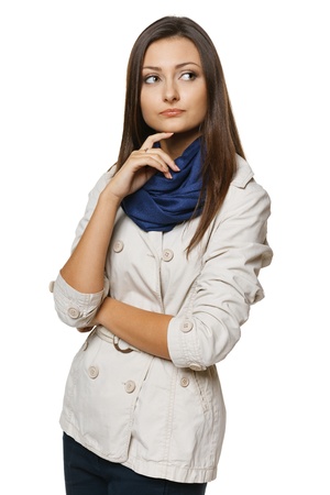 Discontent pensive woman looking to the side, over white backgroundの写真素材