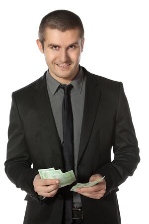 Young business man counting Euro money over white backgroundの写真素材