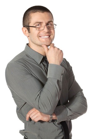 Portrait of young businessman in eyeglasses with hands folded isolated on white backgroundの写真素材
