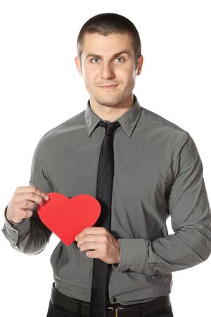 Young  businessman holds a hert shape, isolated on white backgroundの写真素材