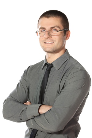 Portrait of young businessman in eyeglasses with hands folded isolated on white backgroundの写真素材