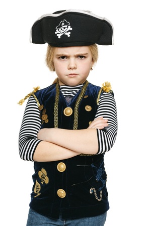 Angry little pirate standing with folded hands, over white backgroundの写真素材
