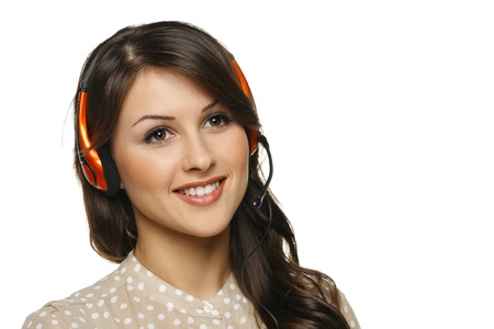 Smiling cheerful support phone operator woman in headset looking out of frame, isolated on white backgroundの写真素材