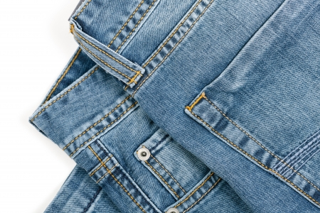 Cropped picture of blue jeans  over white backgroundの写真素材