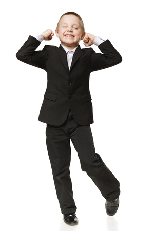 6 years old boy screaming of joy over white backgroundの写真素材