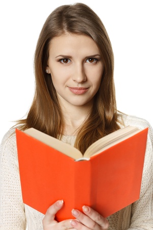 Closeup of smiling woman student with opened book, over white backgroundの写真素材