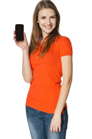 Happy young casual woman showing blank credit card, over white background の写真素材