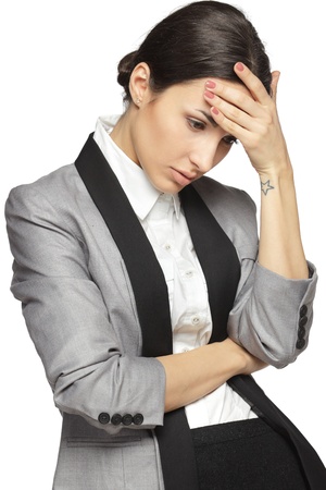 Young thinking business woman stressed, isolated on white backgroundの写真素材