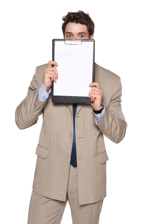 Business man holding blank papper clipboard in front of his face, against white backgroundの写真素材
