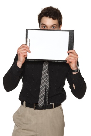 Business man holding blank paper clipboard in front of his face, against white backgroundの写真素材