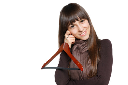 Lovely female holfing empty clothing hangerの写真素材