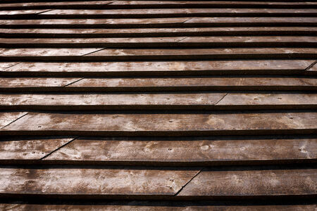 Brown wood plank overlapping roof texture backgroundの写真素材