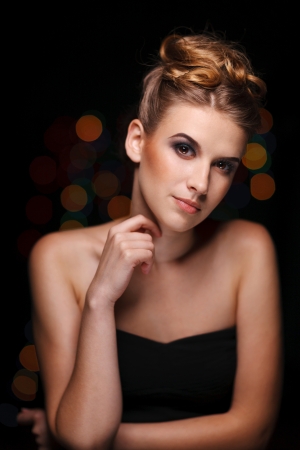 Glamour portrait of beautiful woman with smoky makeup on dark backgroundの写真素材