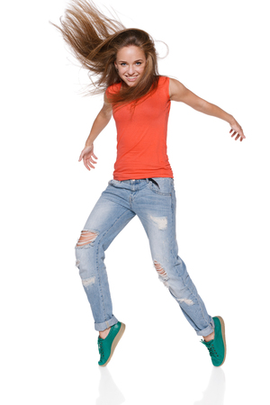 young woman hip hop dancer with grunge wall textureの写真素材