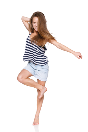 Woman hip hop dancer over white backgroundの写真素材