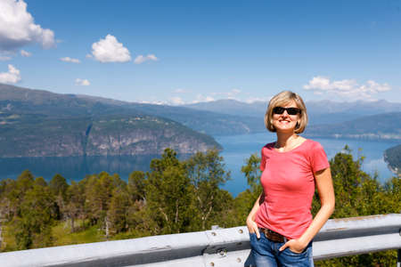 Young woman tourist, fjord, Norwayの写真素材