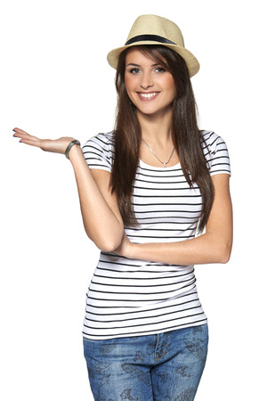 Woman showing / holding on the palm blank copy space over white backgroundの写真素材