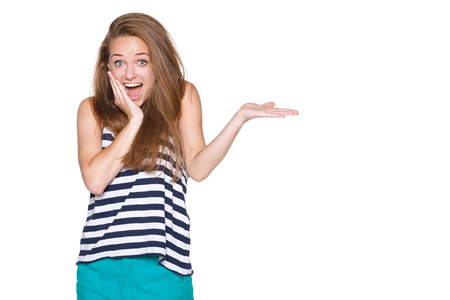 Surprised woman showing open hand palm with copy space for product or textの写真素材