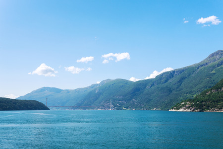Remote view at the modern bridge over fjordの写真素材