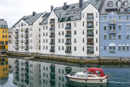 Downtown Alesund, Norway  Art Nouveau architecture  Boat in the harborの写真素材