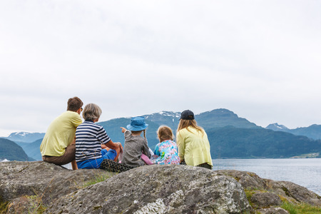 NORDFJORDEN, NORWAY - 28 JULY, 2013: family relaxing enjoying at the fjord coast in a summer sunny day, Norwayの写真素材