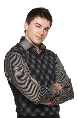 Attractive young man looking calm and confident, isolated on whiteの写真素材