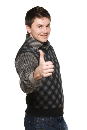 Young businessman giving you thumb up, a sign of approvalの写真素材