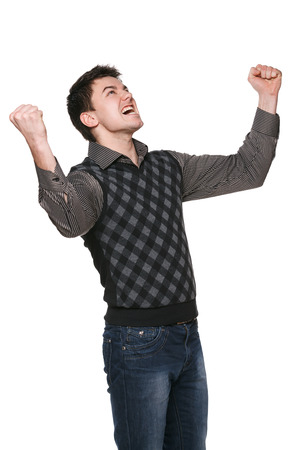 Young businessman with his arms raised in triumph, over whiteの写真素材