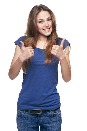Young cute smiling emotional girl giving you double thumb up, isolated on whiteの写真素材
