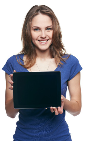 Woman showing tablet screen smiling isolated on white backgroundの写真素材