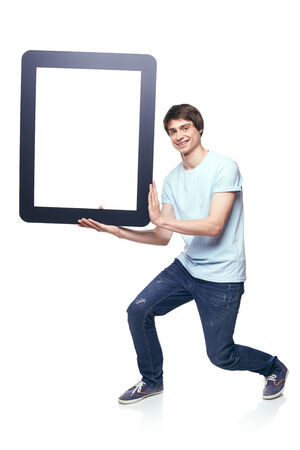 Full length man carrying tablet frame, over white backgroundの写真素材