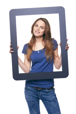 Smiling woman holding tablet frame, over white backgroundの写真素材
