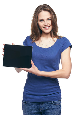 Woman showing tablet screen smiling isolated on white backgroundの写真素材