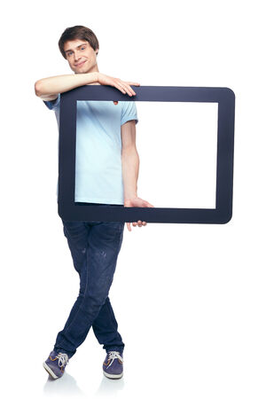 Full length man holding tablet frame, over white backgroundの写真素材