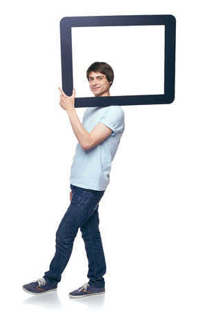 Full length man carrying tablet frame on his shoulder, over white backgroundの写真素材