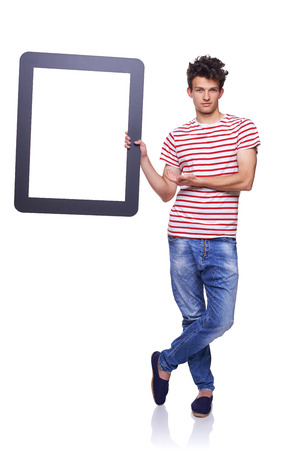 Full length man holding empty frame - copy space for text, over white backgroundの写真素材