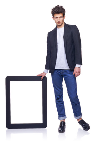 Full length man holding empty frame - copy space for text, over white backgroundの写真素材